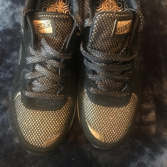 sketchers black and gold